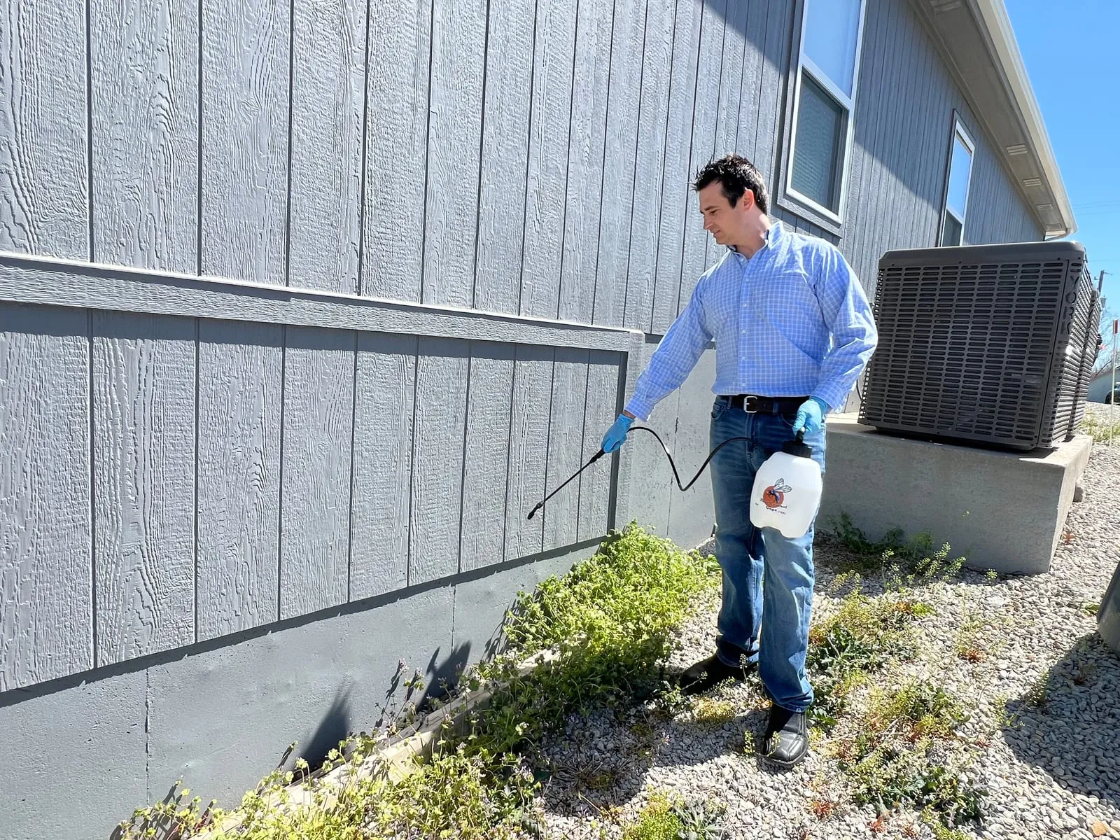A pest-control professional treating a home